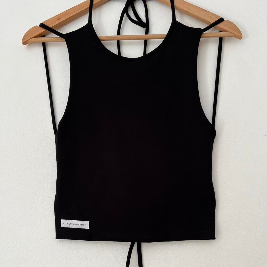 With Consideration Backless Tie Top in Black.