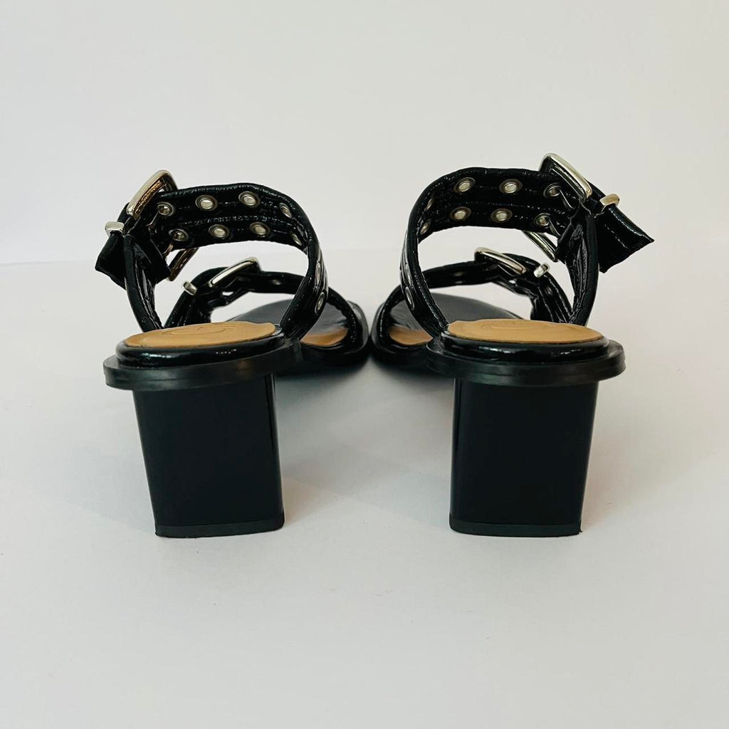 Ganni Leather Buckle Heels in Black.