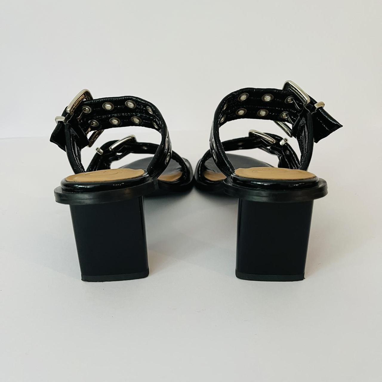 Ganni Leather Buckle Heels in Black.