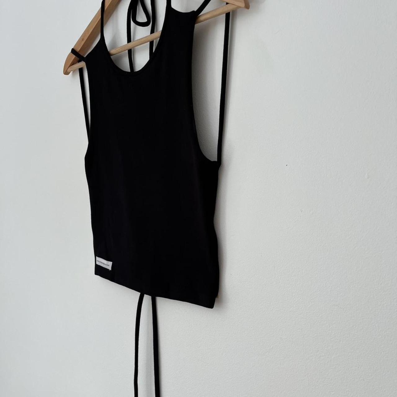 With Consideration Backless Tie Top in Black.