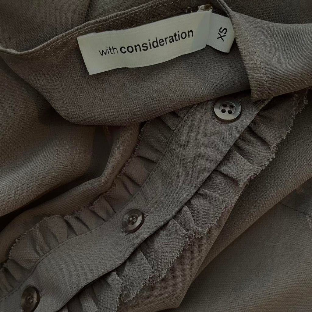 With Consideration Sheer Ruffle Long Sleeve Blouse in Slate Size XS.
